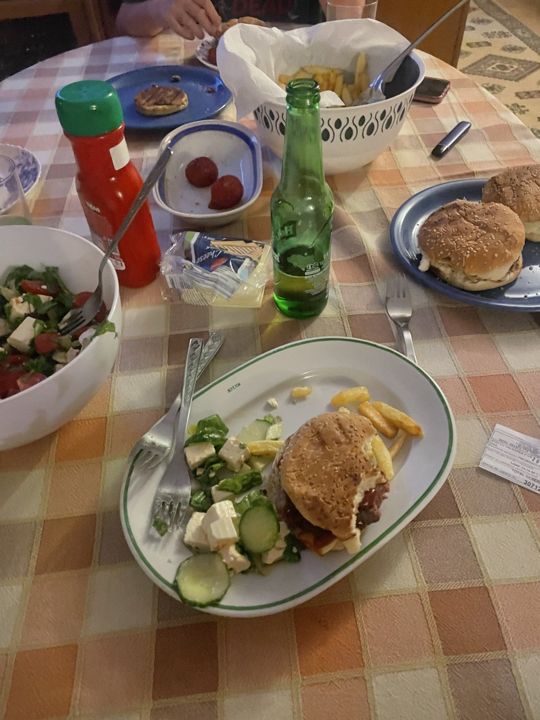 A table with plates and drinks after an event