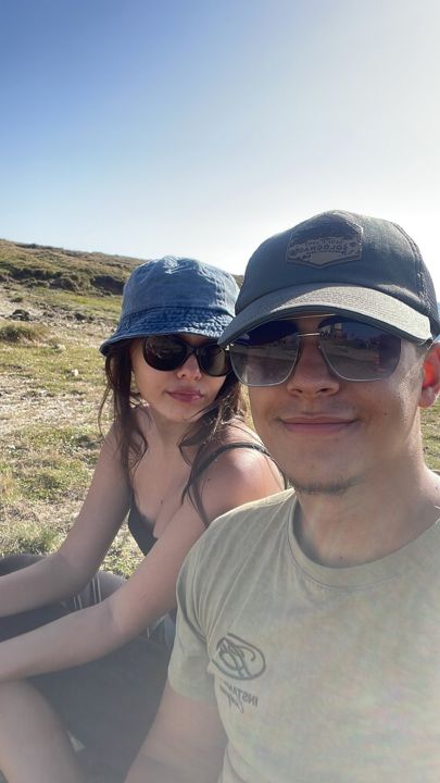 Two friends taking a selfie on a mountain