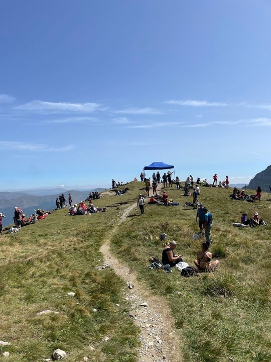 A crowd of hikers on a mountain top